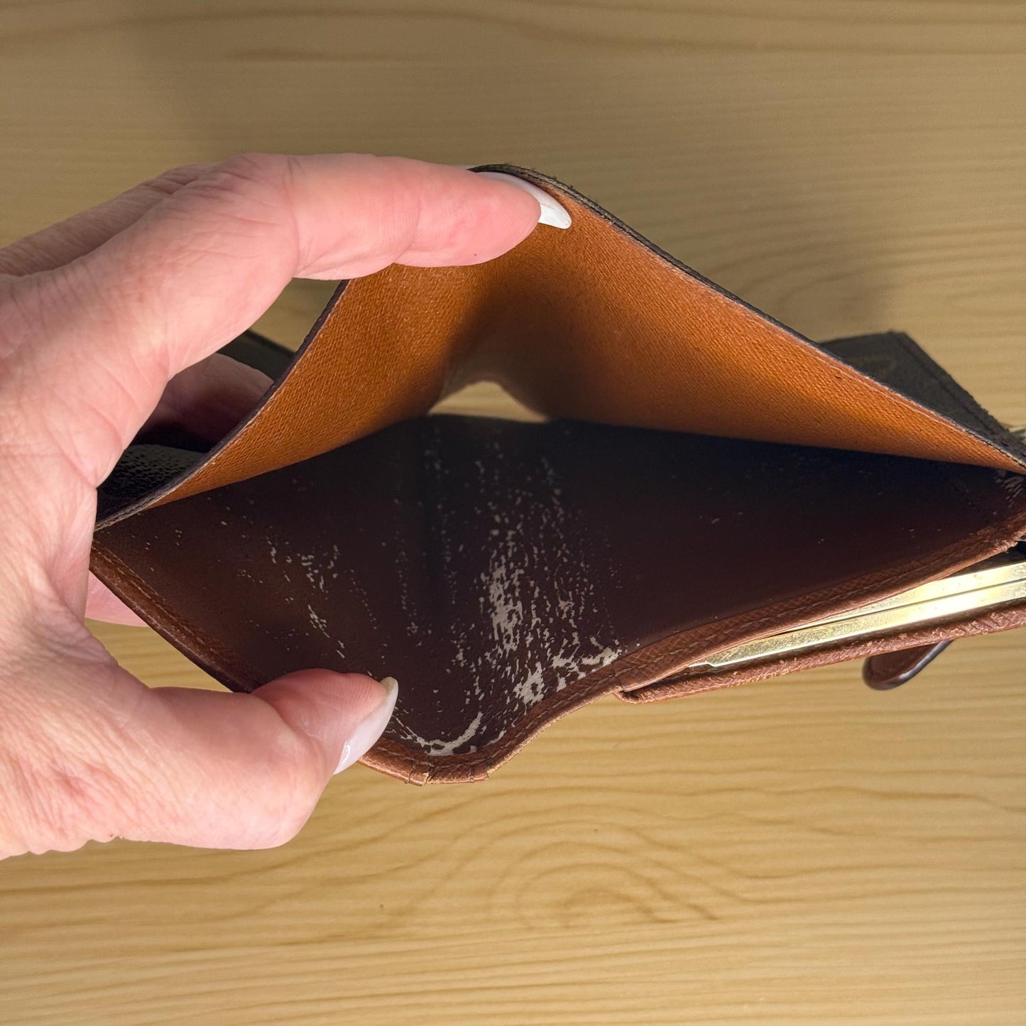 Slight peeling in the inside of money pocket.