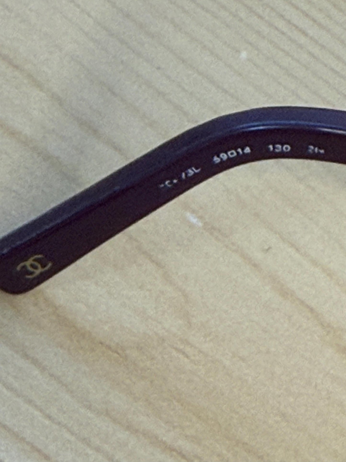 Chanel sunglasses in a dark plum